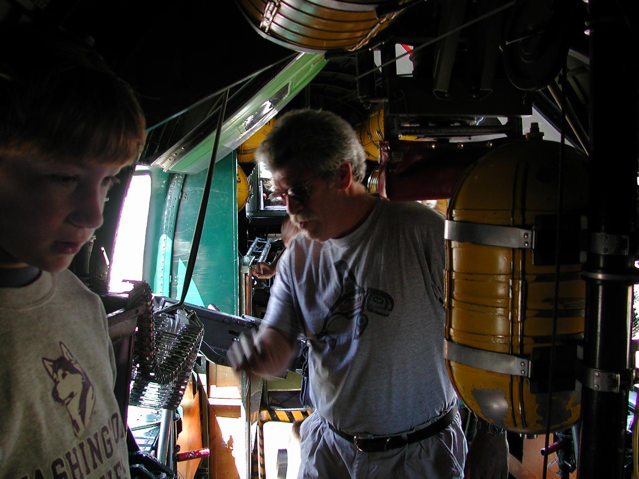 Inside the B-24, looking aft, form just behind bomb bay