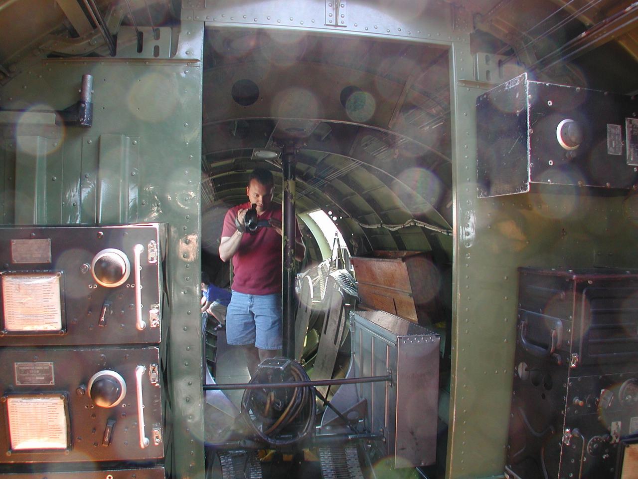 From radio room, looking into rear gunner section, and also belly gunner (left of silver ammo box)