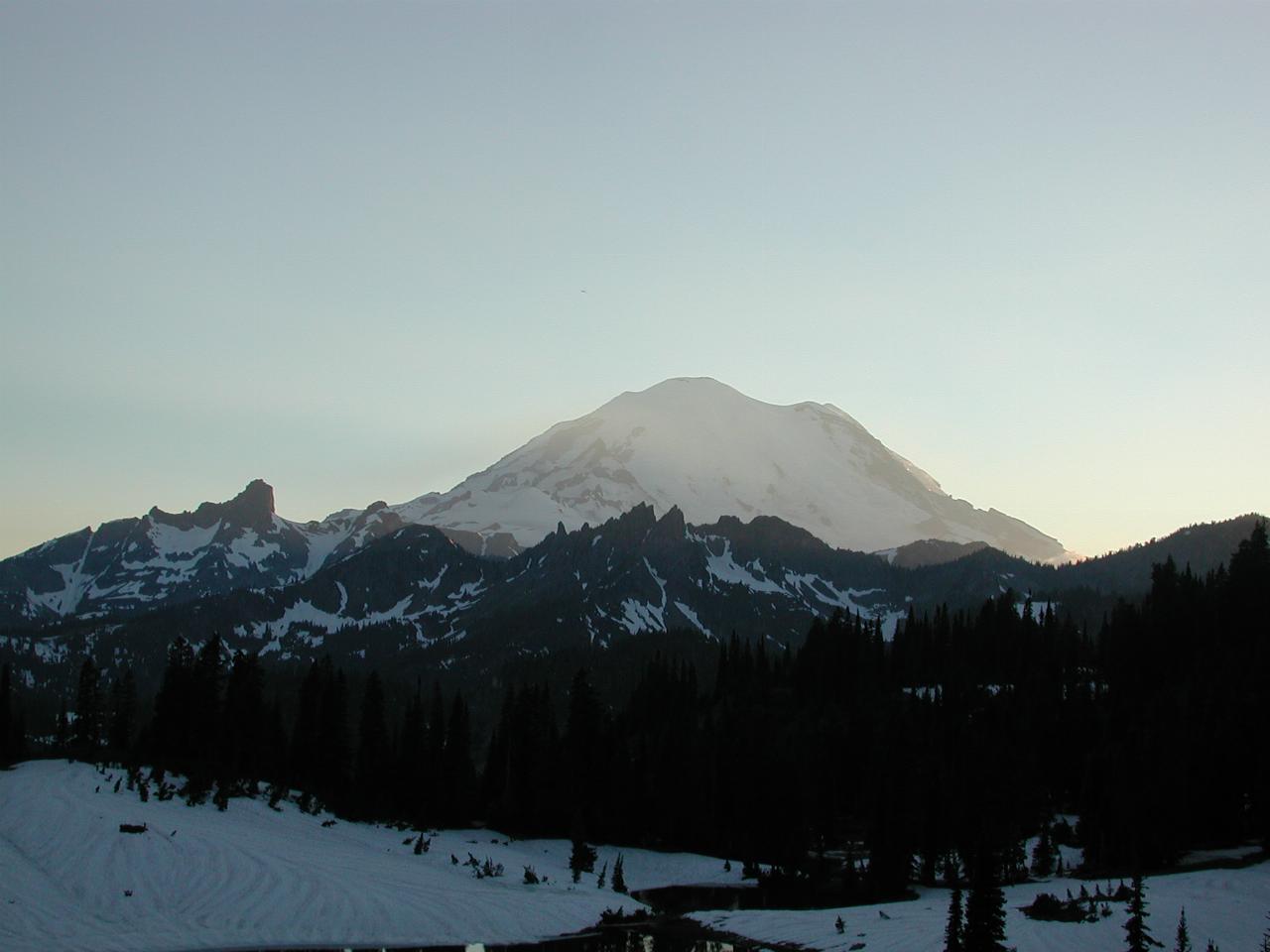 Mt. Rainier with the rays of the sun near sunset