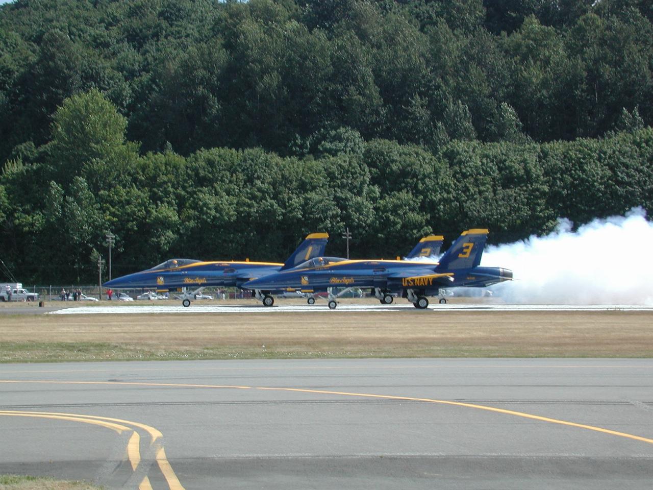 Blue Angels starting take off roll with smoke effects