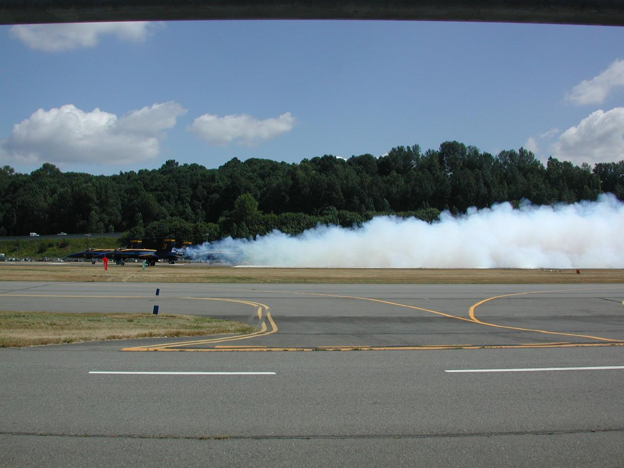 Blue Angels starting take off roll with smoke effects