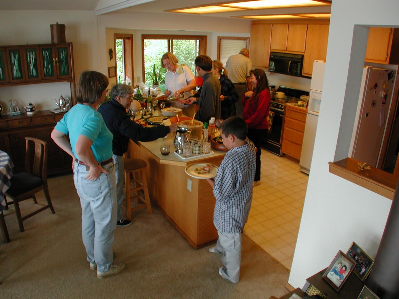 Too many cooks: Mary Kay, Marie, Thomas, Maria, Pilar, Nck, Patty, Bill (back to camera)