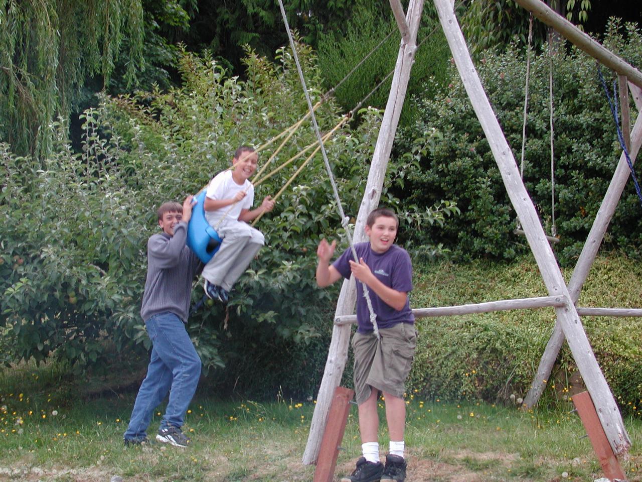 Nick, Thomas and Michael on the swings