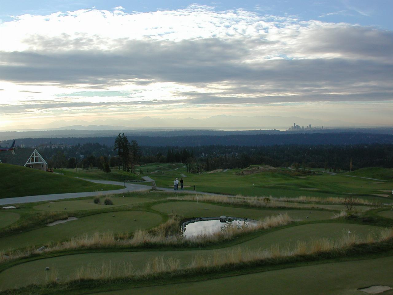 Sunset view of downtown Seattle and Olympic Mountains as seen from Newcastle Golf Club