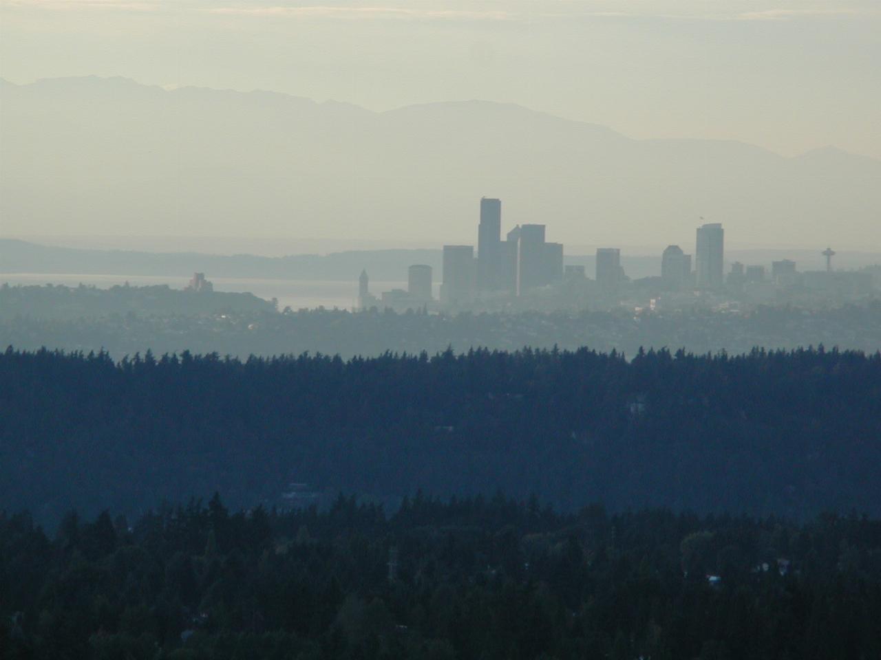 Sunset view of downtown Seattle and Olympic Mountains as seen from Newcastle Golf Club