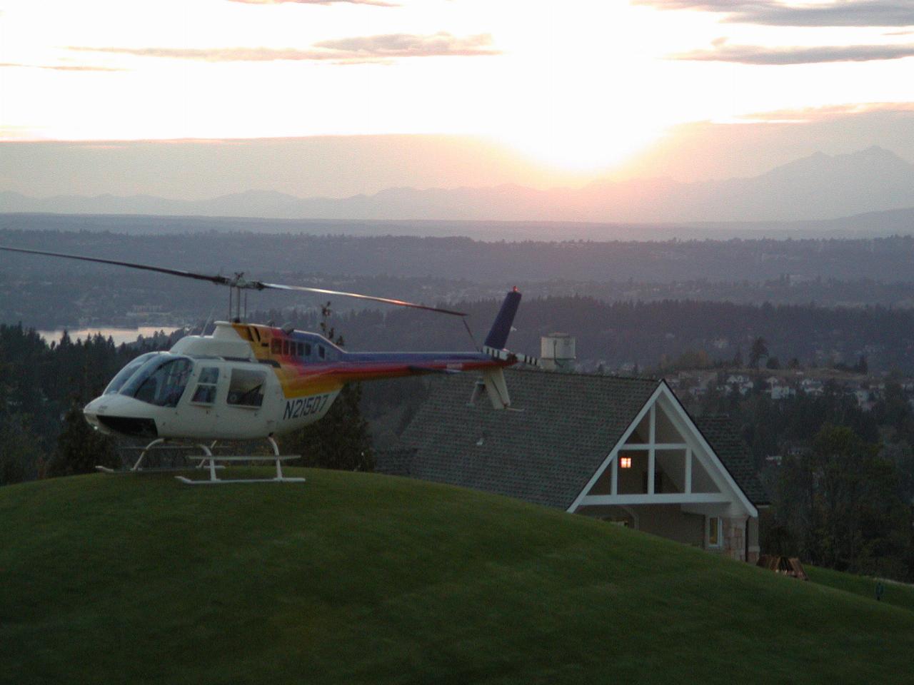 Sunset behind Olympic Mountains and helicopter at Newcastle Golf Club (for wedding reception)