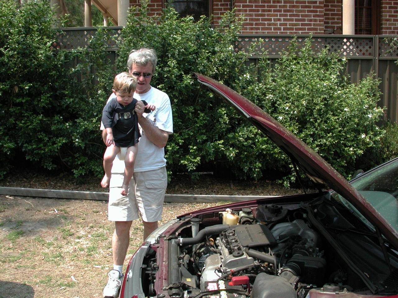 Peter showing Jake his Camry's engine