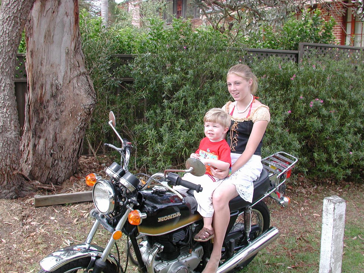 Jake's first motorcycle sit - with neighbour Amy