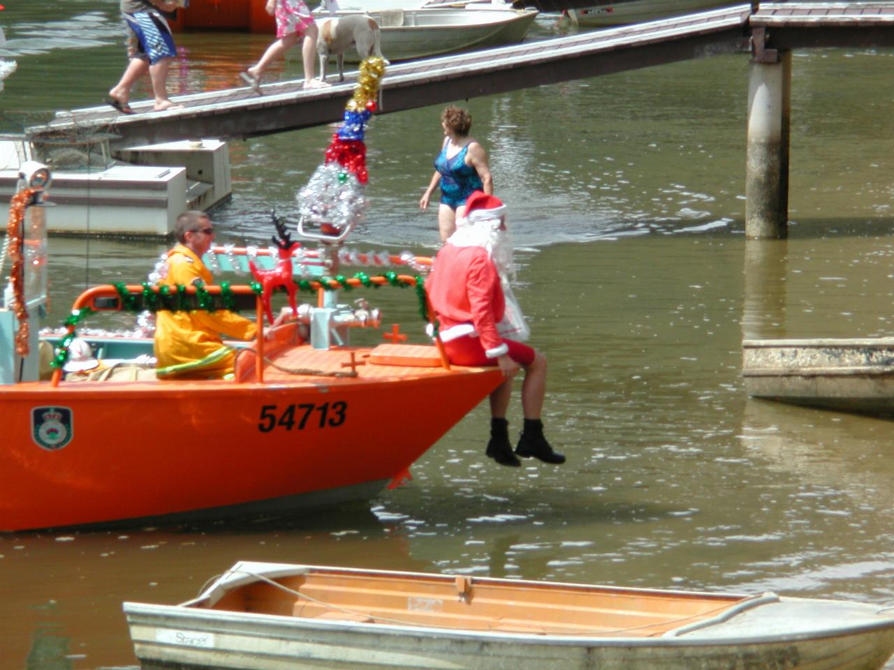 Santa's dressed appropriately as boat nears shore