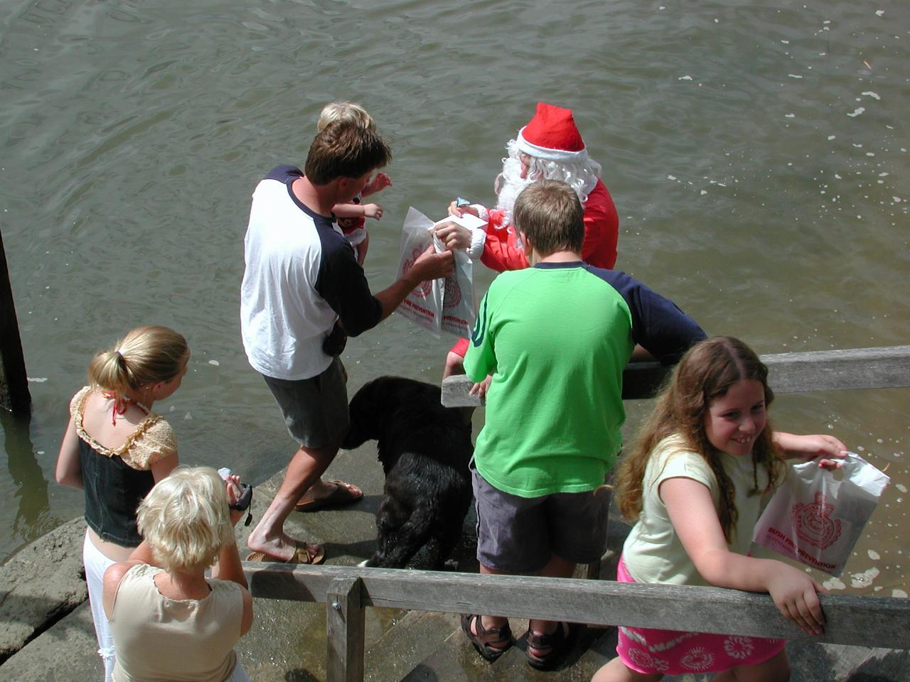 Cameron and Jake collecting their present from Santa