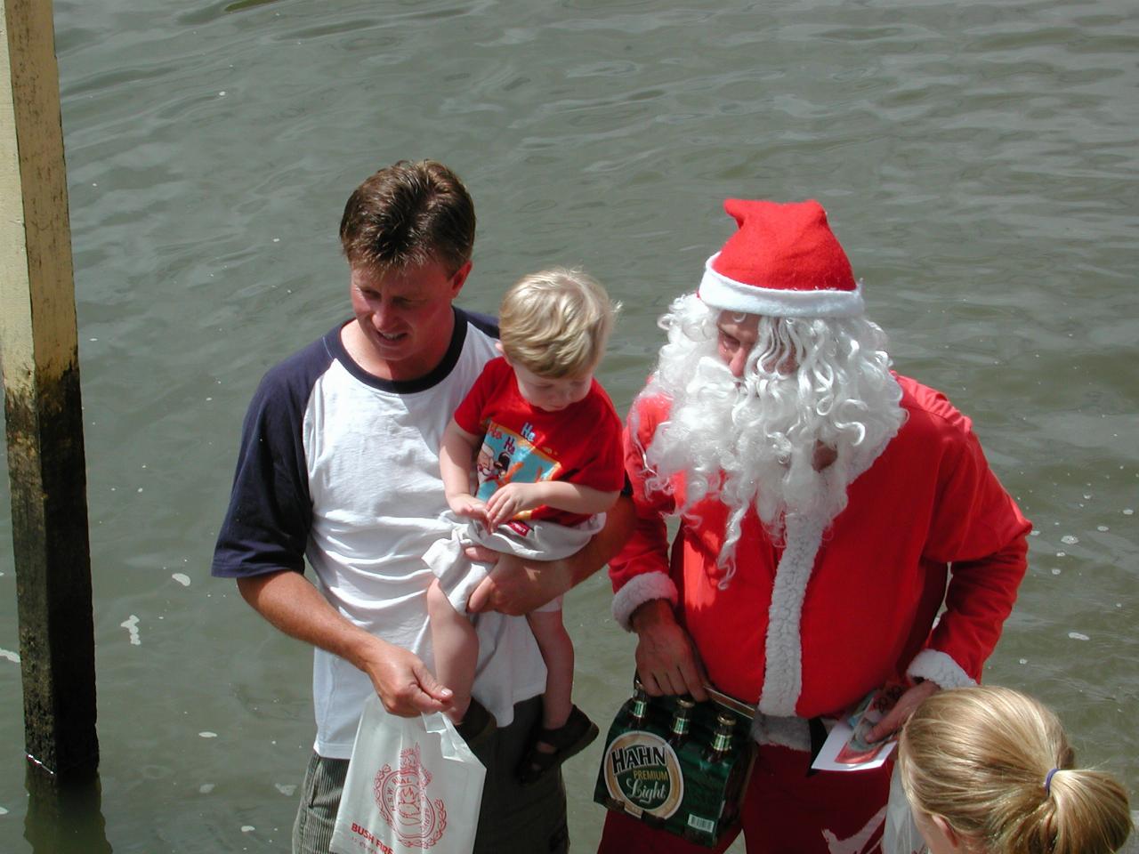 Cameron and Jake pose with Santa