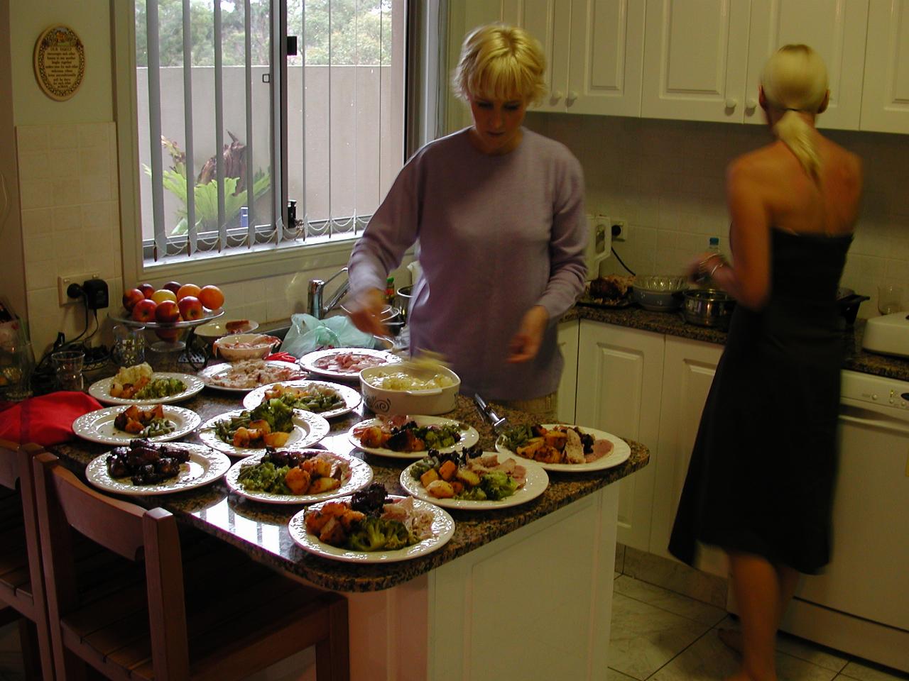 Michelle and Kelly, with Christmas dinner on the plates