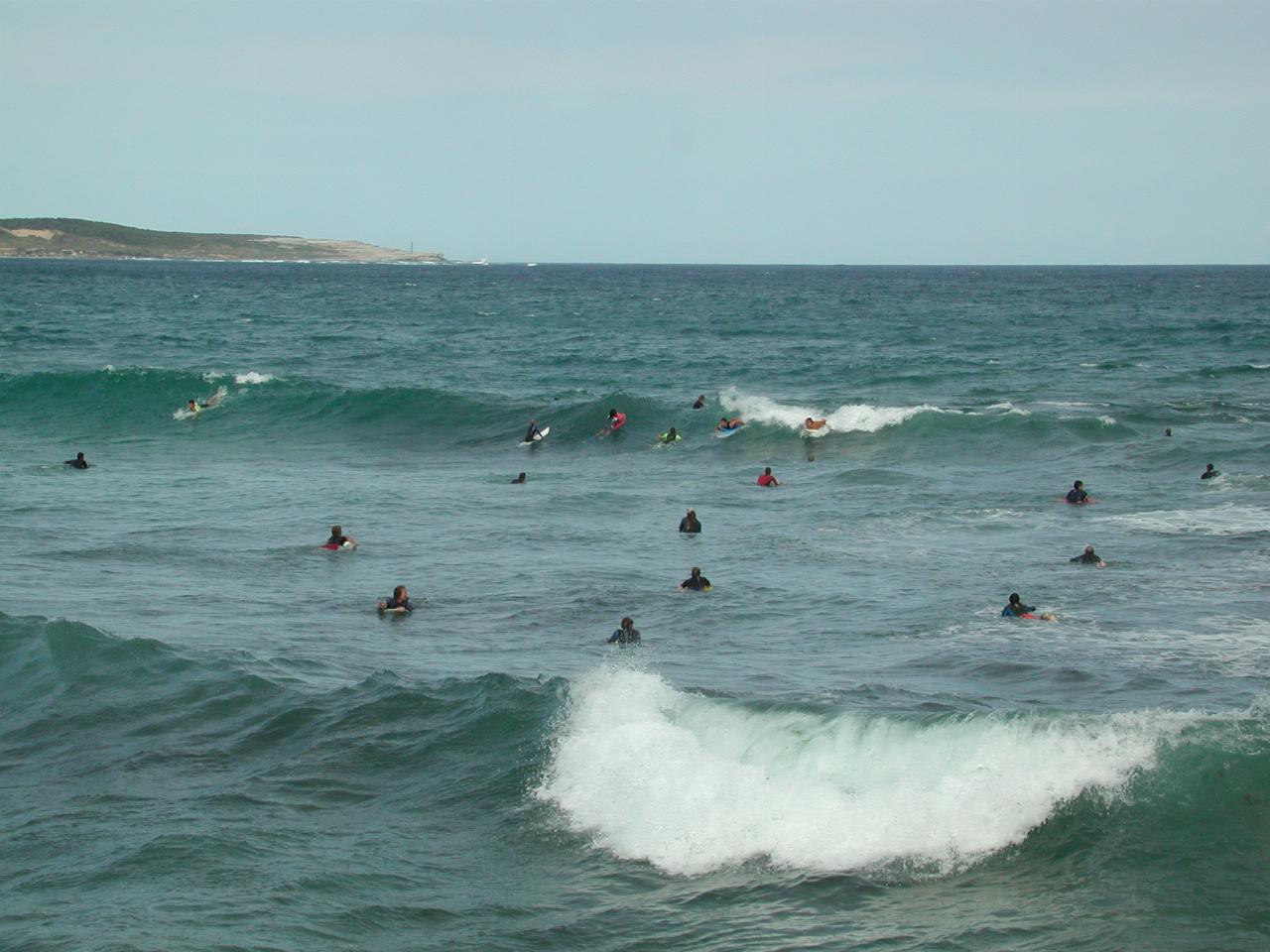 Board riders outside Sealevel restaurant in Cronulla