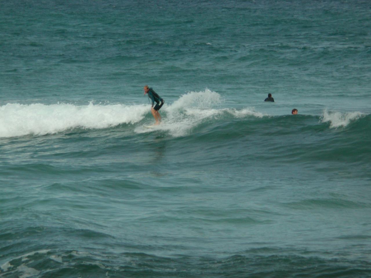 Board riders outside Sealevel restaurant in Cronulla