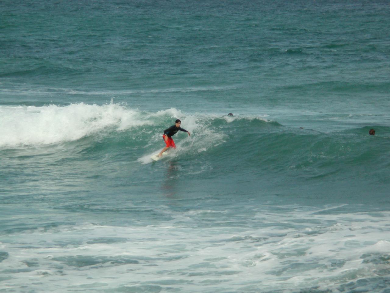 Board riders outside Sealevel restaurant in Cronulla