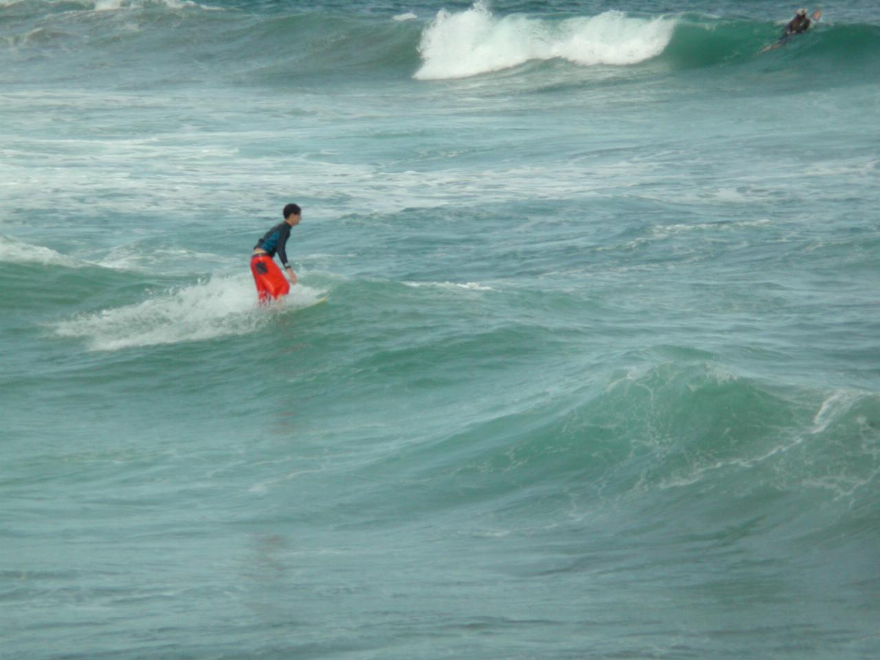 Board riders outside Sealevel restaurant in Cronulla