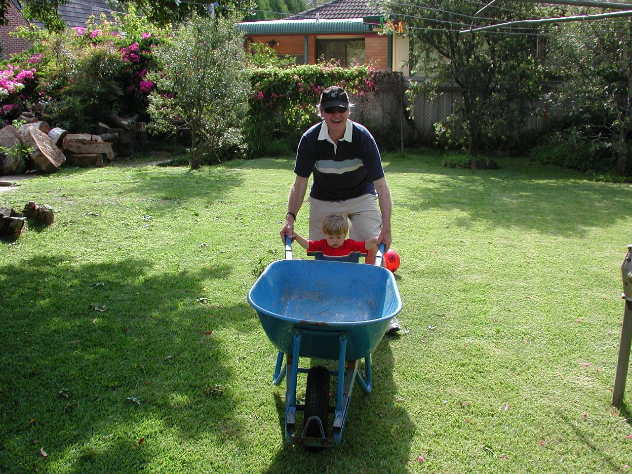 Jake helping Peter move the wheelbarrow