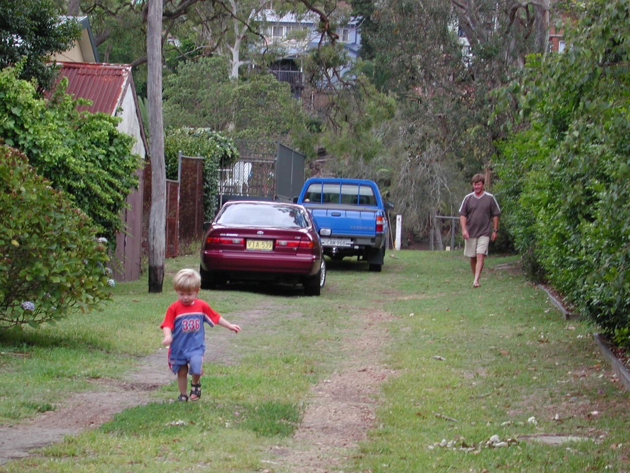 Jake running towards Peter with Cameron watching from behind