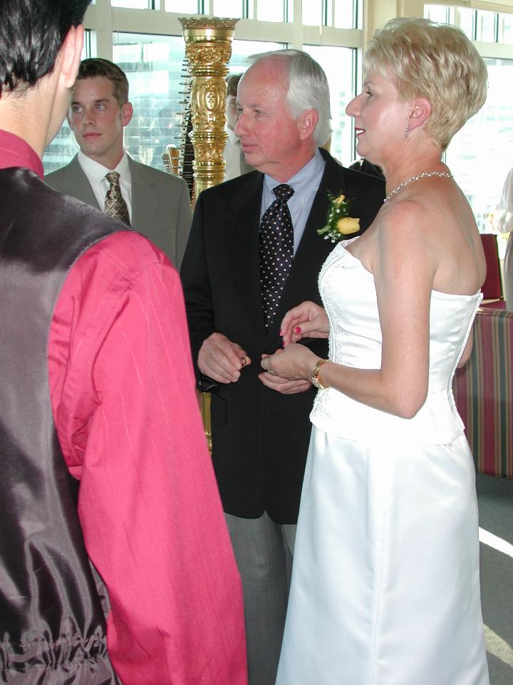 Bill about to put the ring on Judy's finger