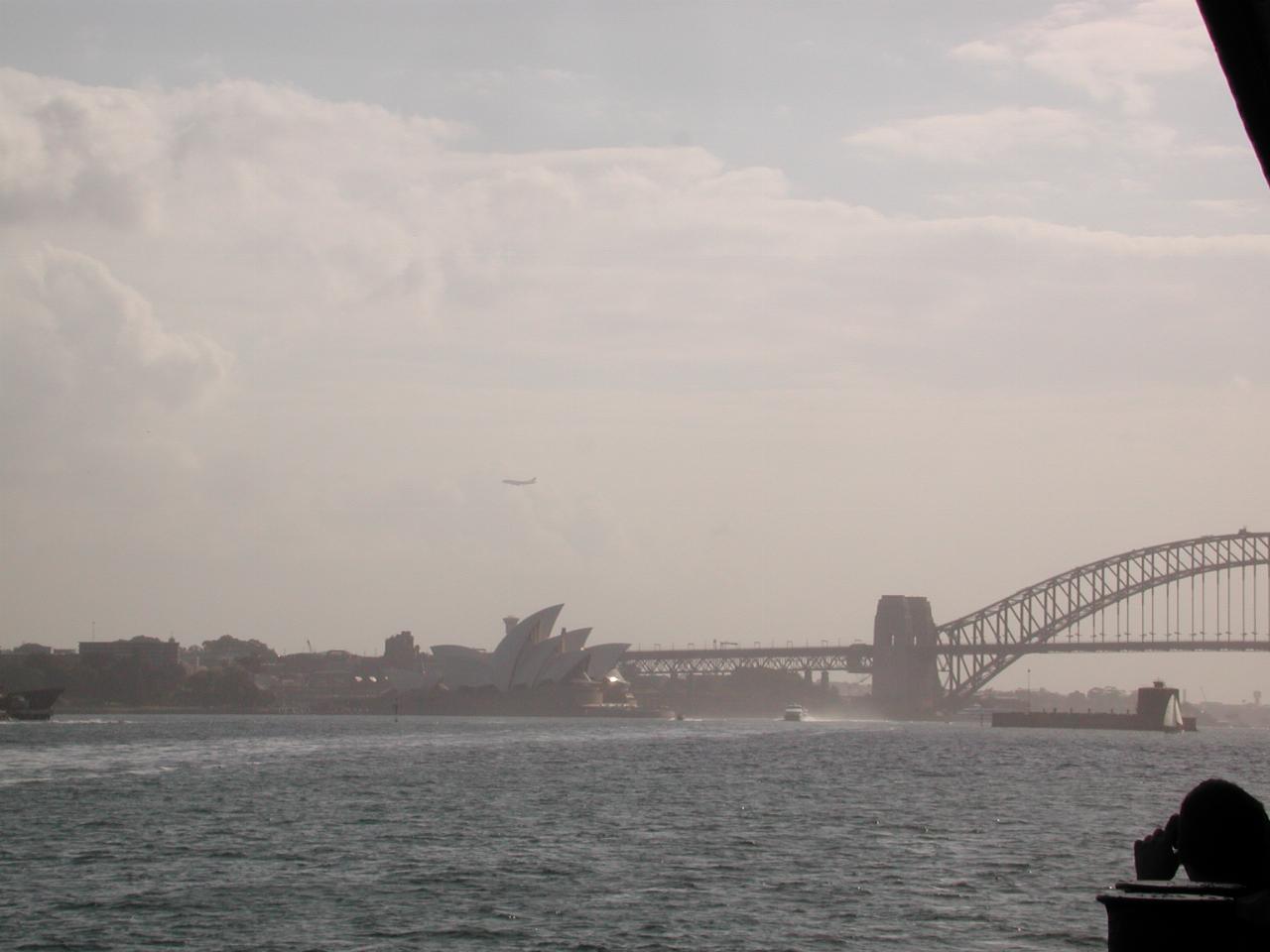 Opera House with incoming 747 and partial Harbour Bridge