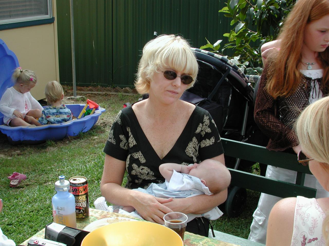 Michelle and Flynn (oblivious to all) at his Baptism celebration