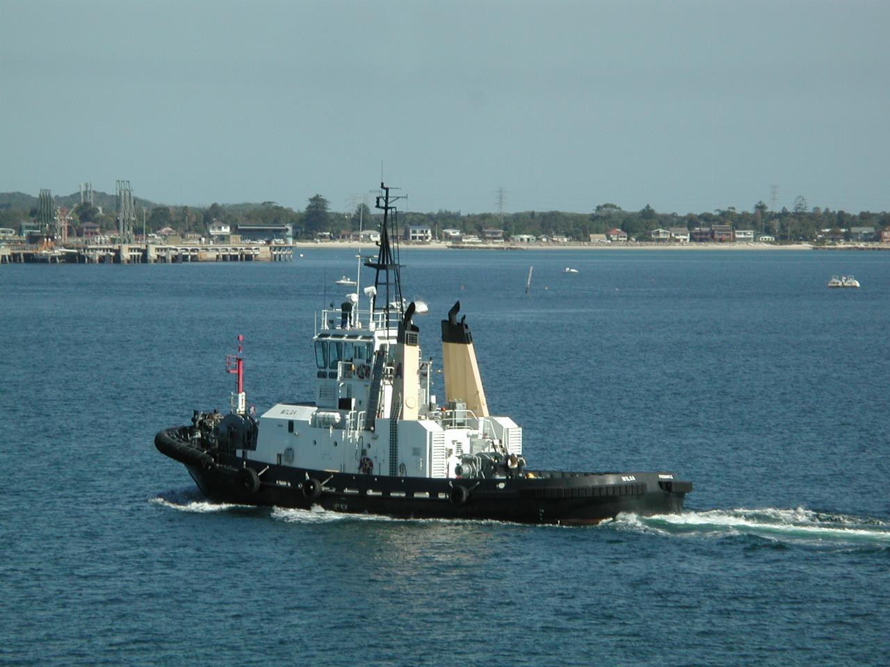 Tug leaving Port Botany to assist a tanker