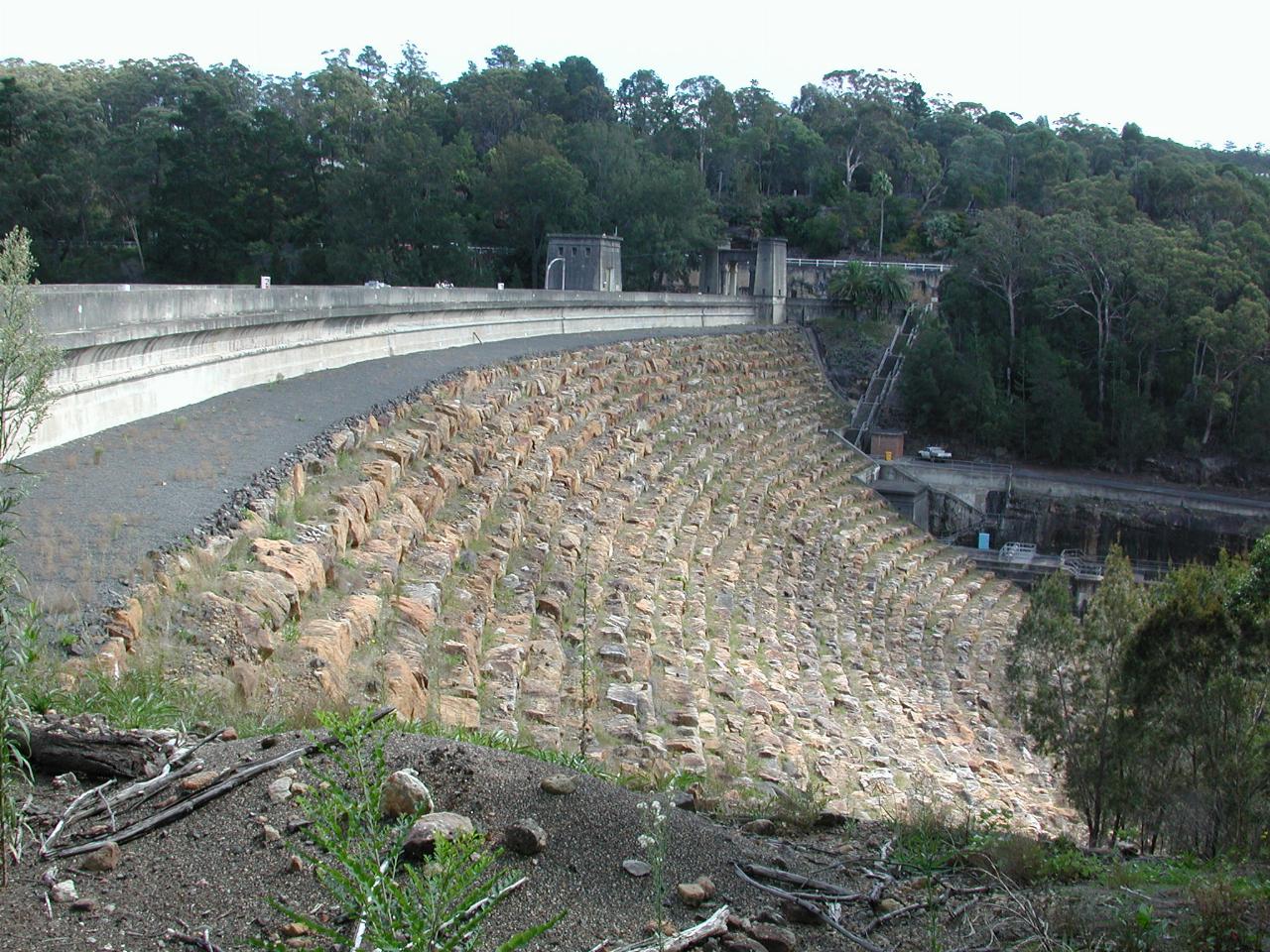 Front view of dam wall, which appears to be sandstone blocks