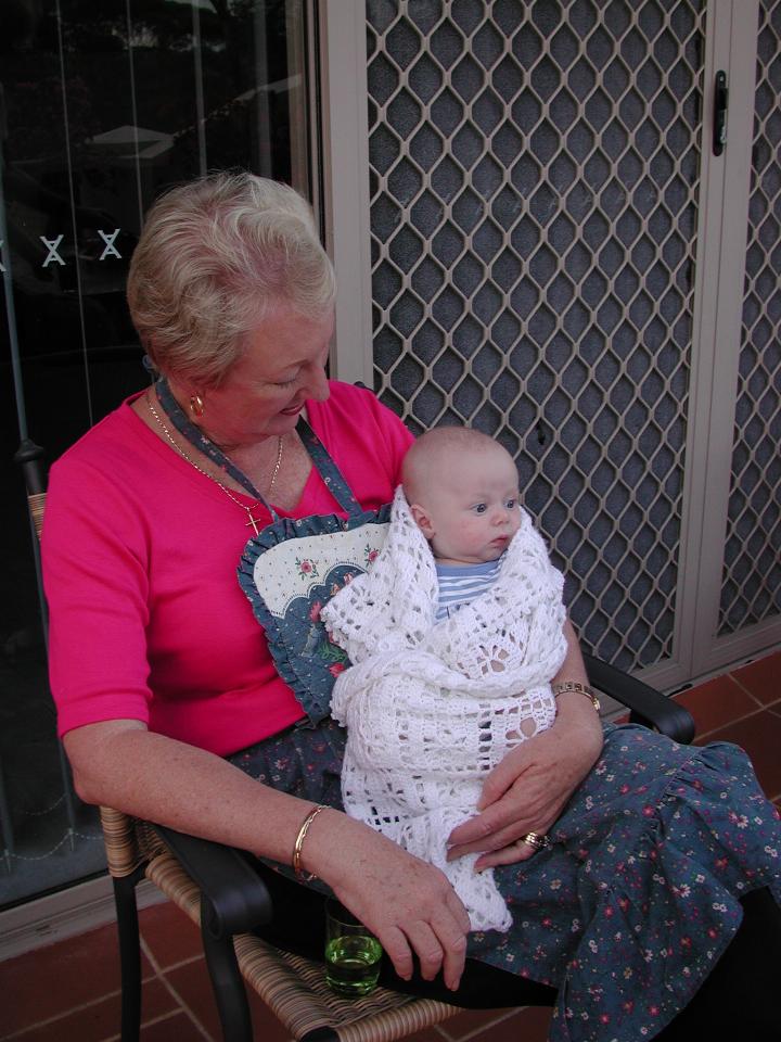 Yvonne holding Flynn during family dinner evening