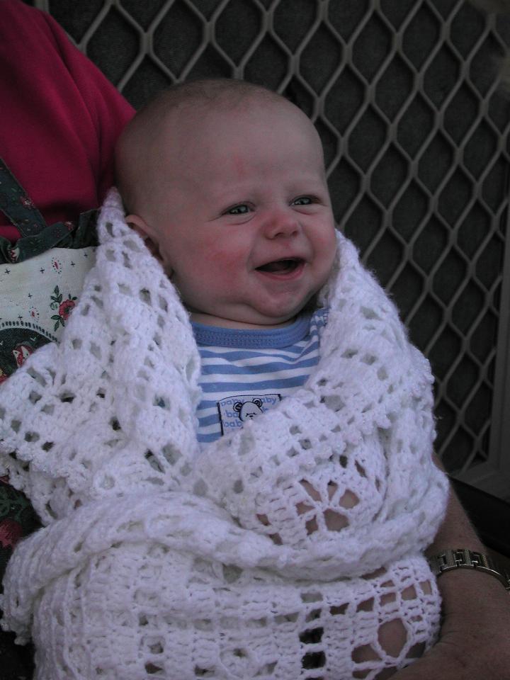 Yvonne holding Flynn during family dinner evening