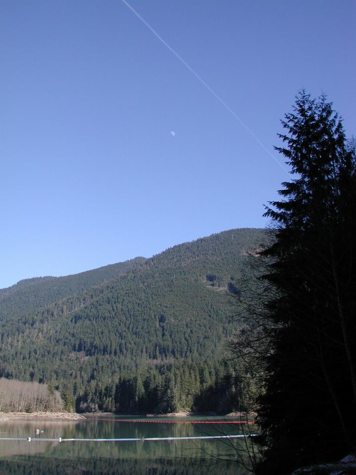 Moon, contrail and calm Baker Lake