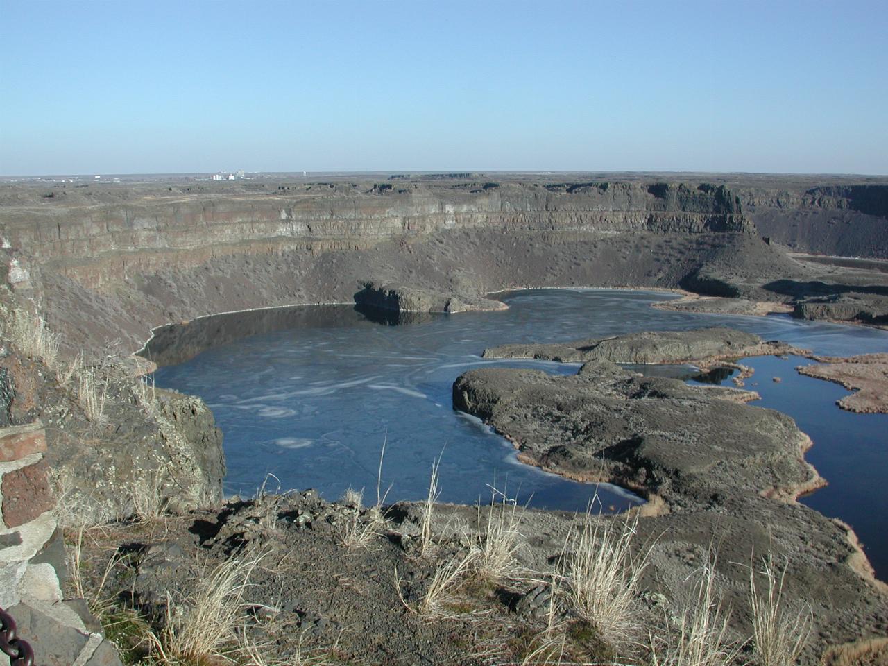 Dry Falls,  with ice on the lake at the base