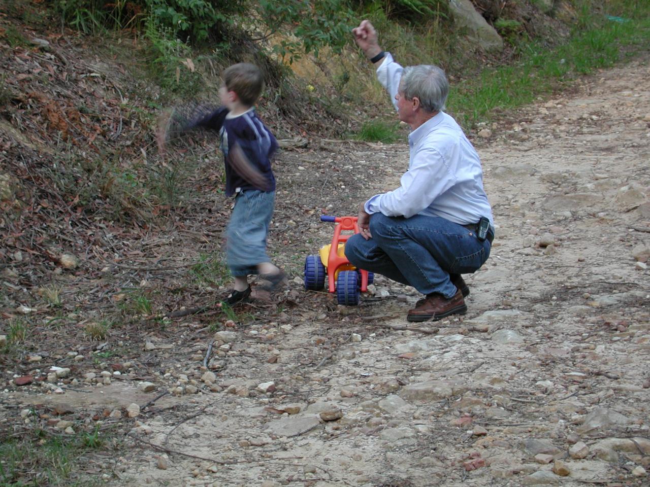 Peter and Jake throwing rocks