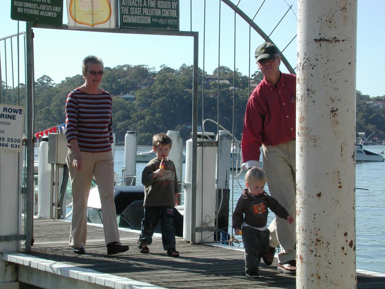 People walking off wharf