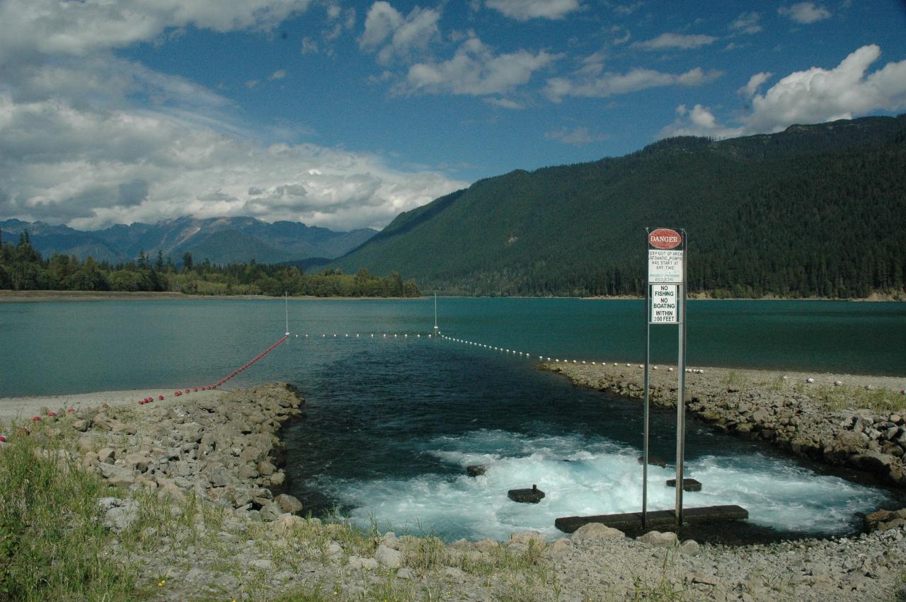 Water being pumped into Baker Lake from side catchment basin; Mt. Shuksan in background