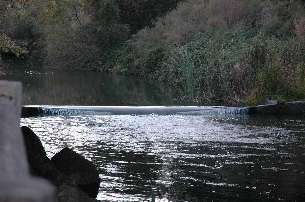 A small weir downstream of Vasona Lake, with a soccer ball caught in the flow at the bottom