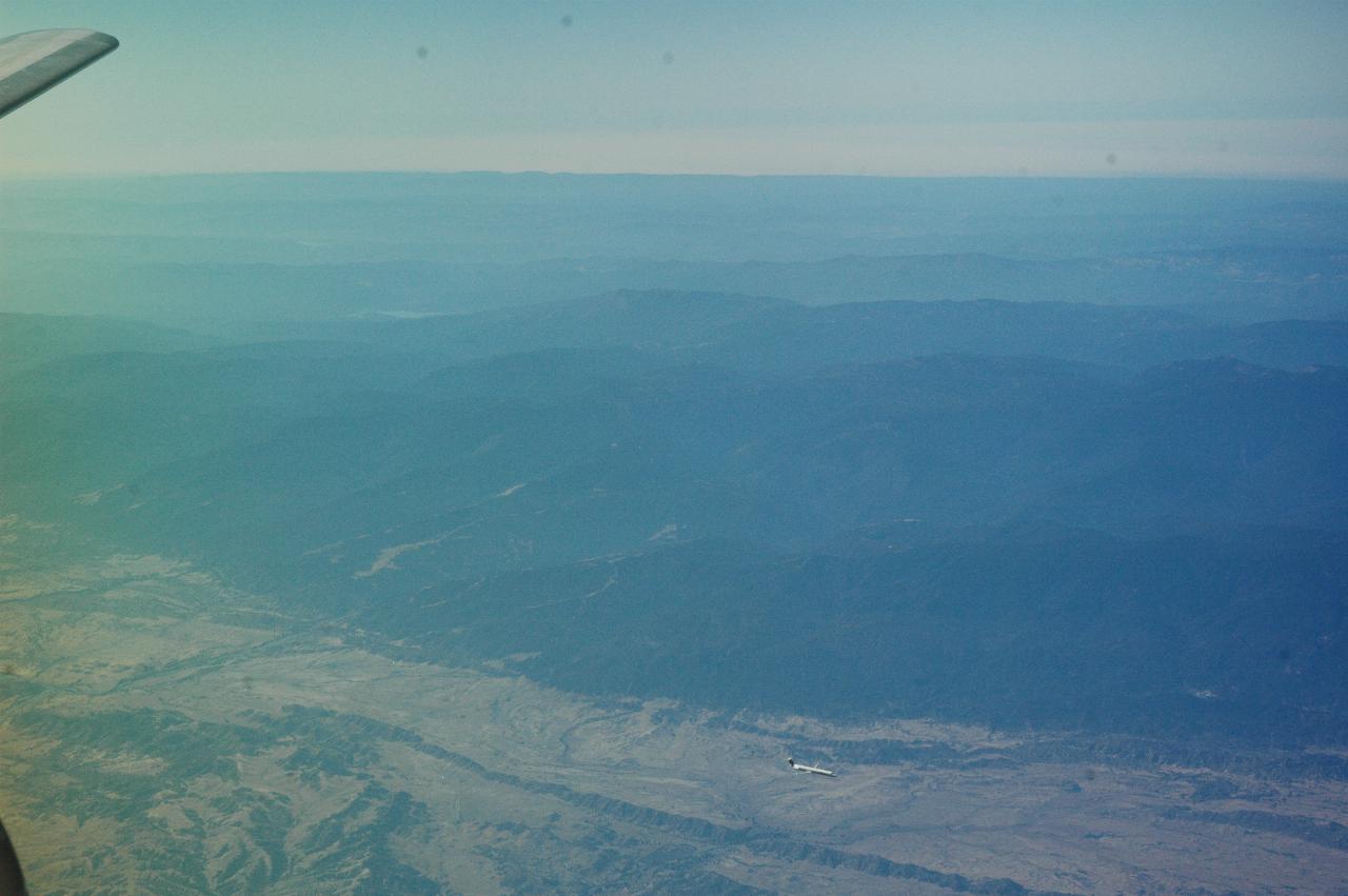 An MD-80 airliner (looks like US Airlines) descending into (probably) Redding, CA airport