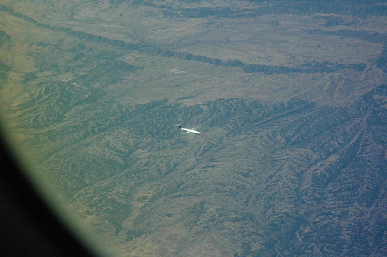 An MD-80 airliner (looks like US Airlines) descending into (probably) Redding, CA airport