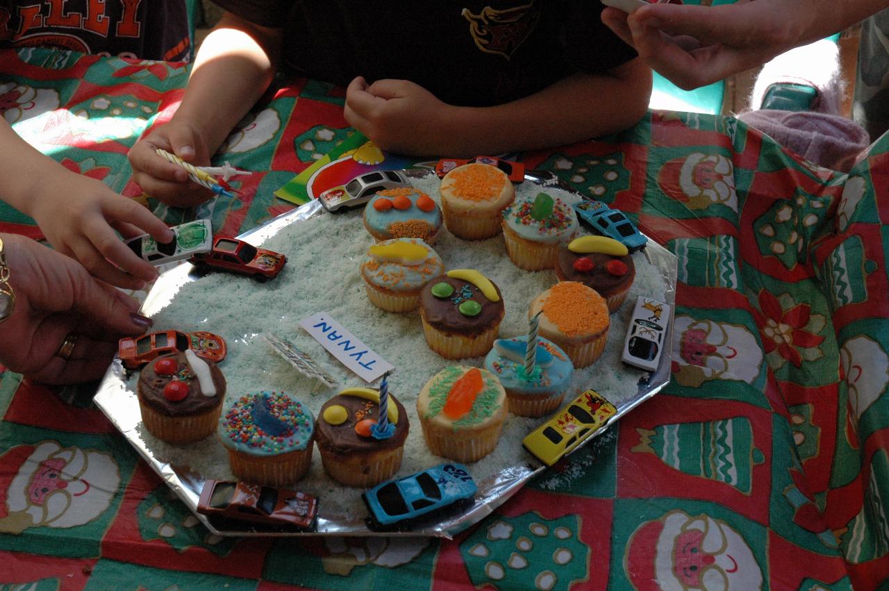 Tynan's birthday cake, with a few candles returned, during Nat's return to London party