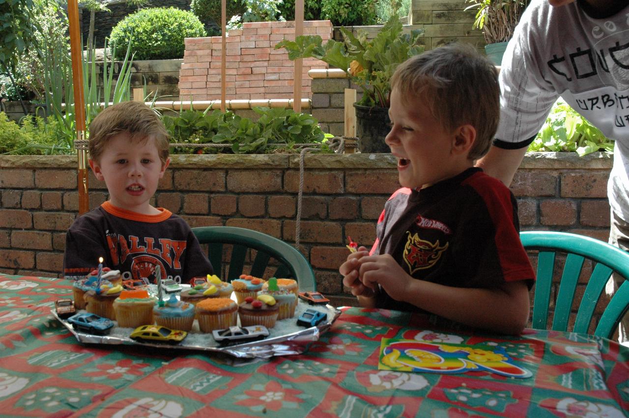 Tynan blowing out candles on his birthday cake (for the second time!) at Nat's farewell to London