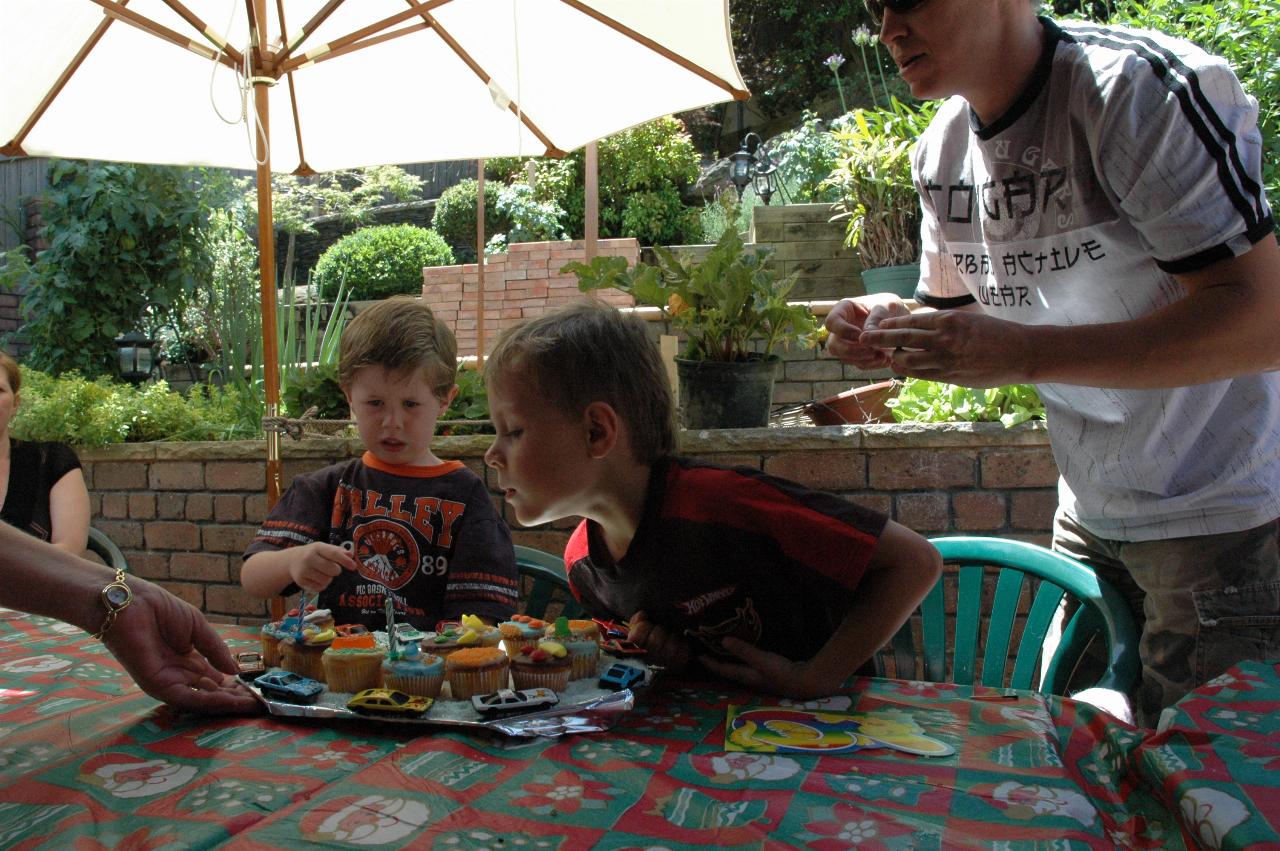 Tynan blowing out candles on his birthday cake (for the second time!) at Nat's farewell to London