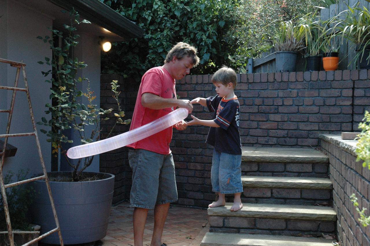 Cameron passing the balloon to Jake to launch at Nat's farewell before return to London