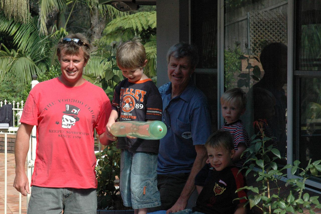 Cameron and Jake holding the balloon before launch, with Peter, Tynan and Flynn watching on