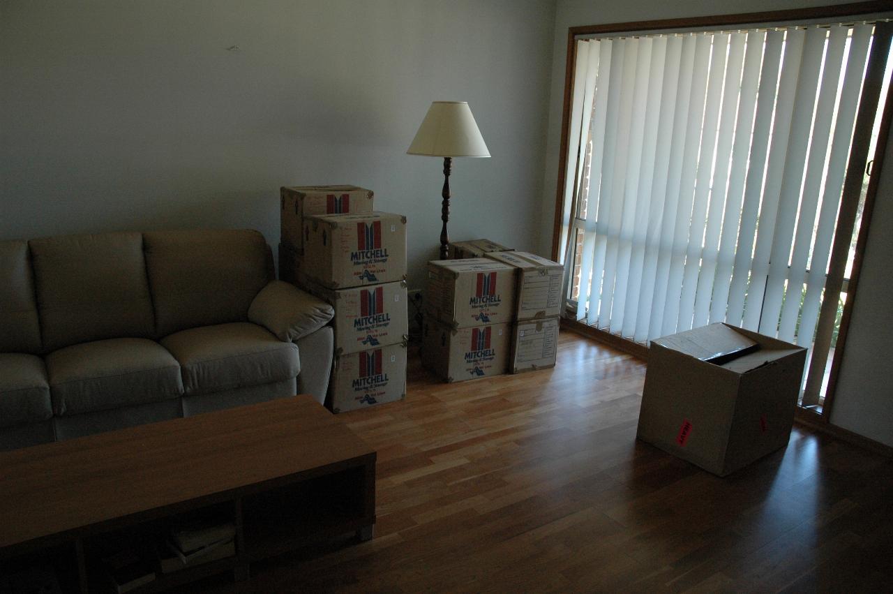 Living room with boxes after movers dropped them off