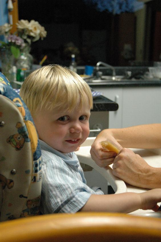 Flynn having an ice block at Crofts' Woronora, after Christmas Eve Mass