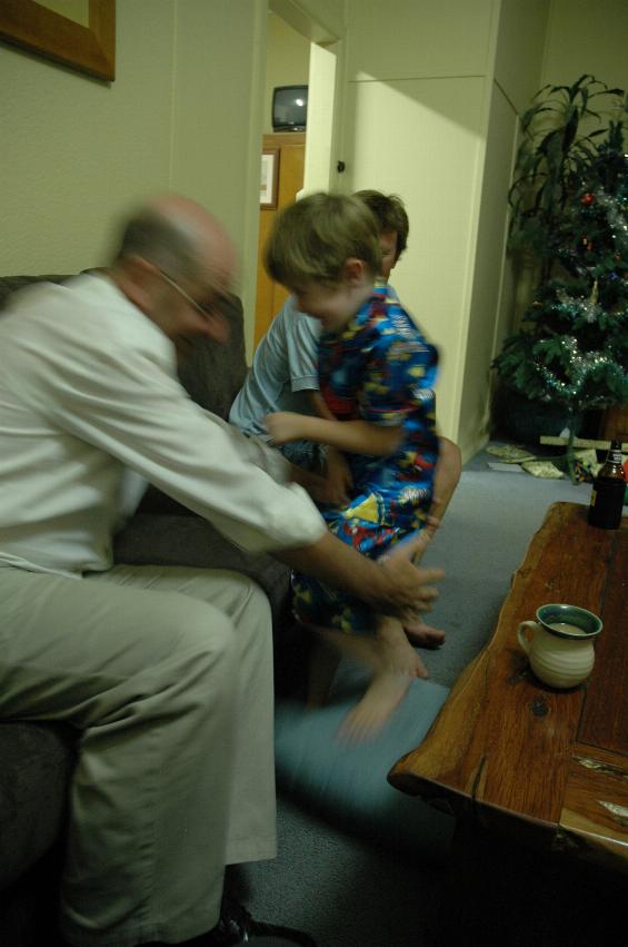 Jake on Christmas Eve with Spiderman pyjamas and Mel Cusi and Cameron