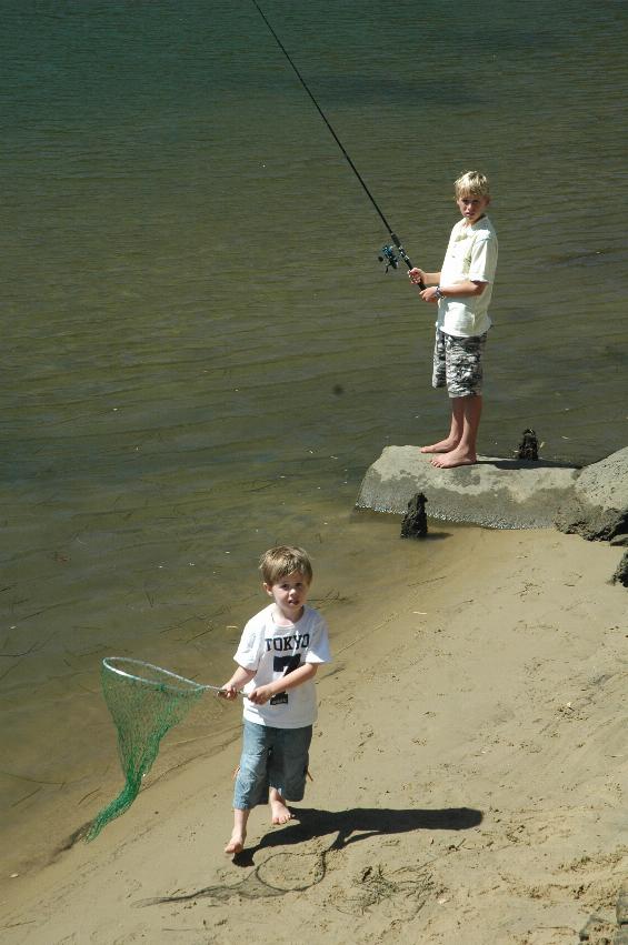 Dylan Crofts fishing, and Jake ready for the big one at Woronora on Christmas morning