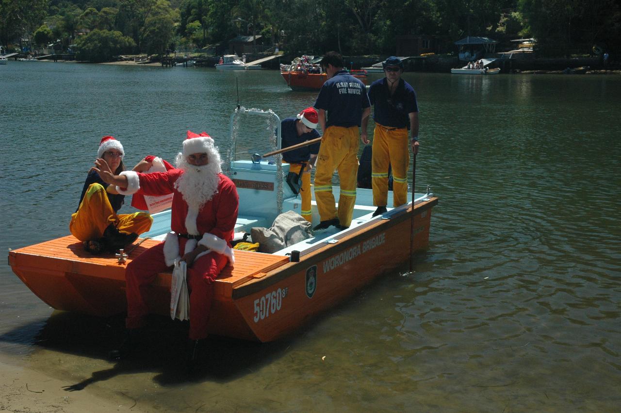 Santa leaves to visit families on the other side of the Woronora River on Christmas morning