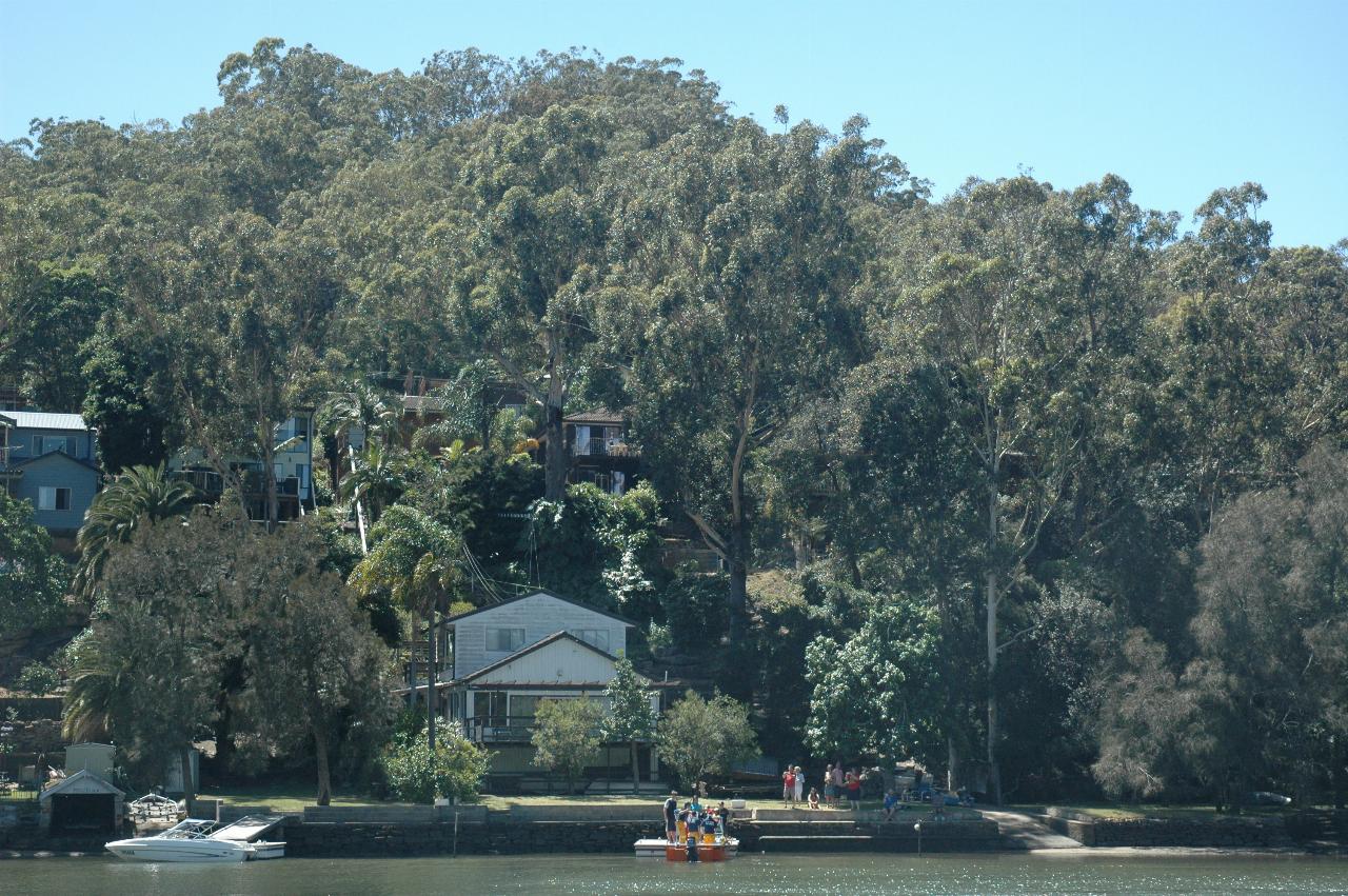 Santa visiting residents on the other side of the Woronora River on Christmas morning