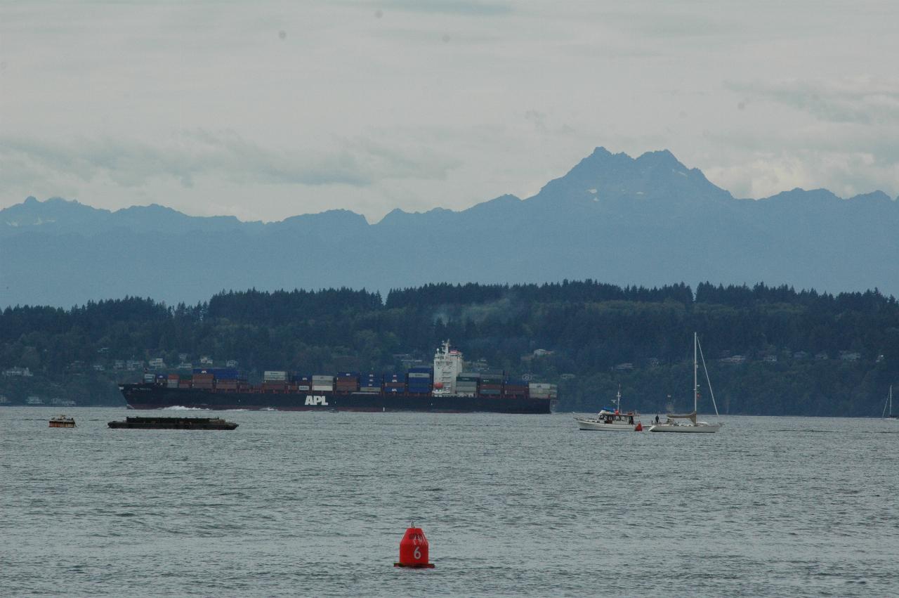 Freighter passing Olympic Mountains, as seen from Anthony's Homeport, Shilshole