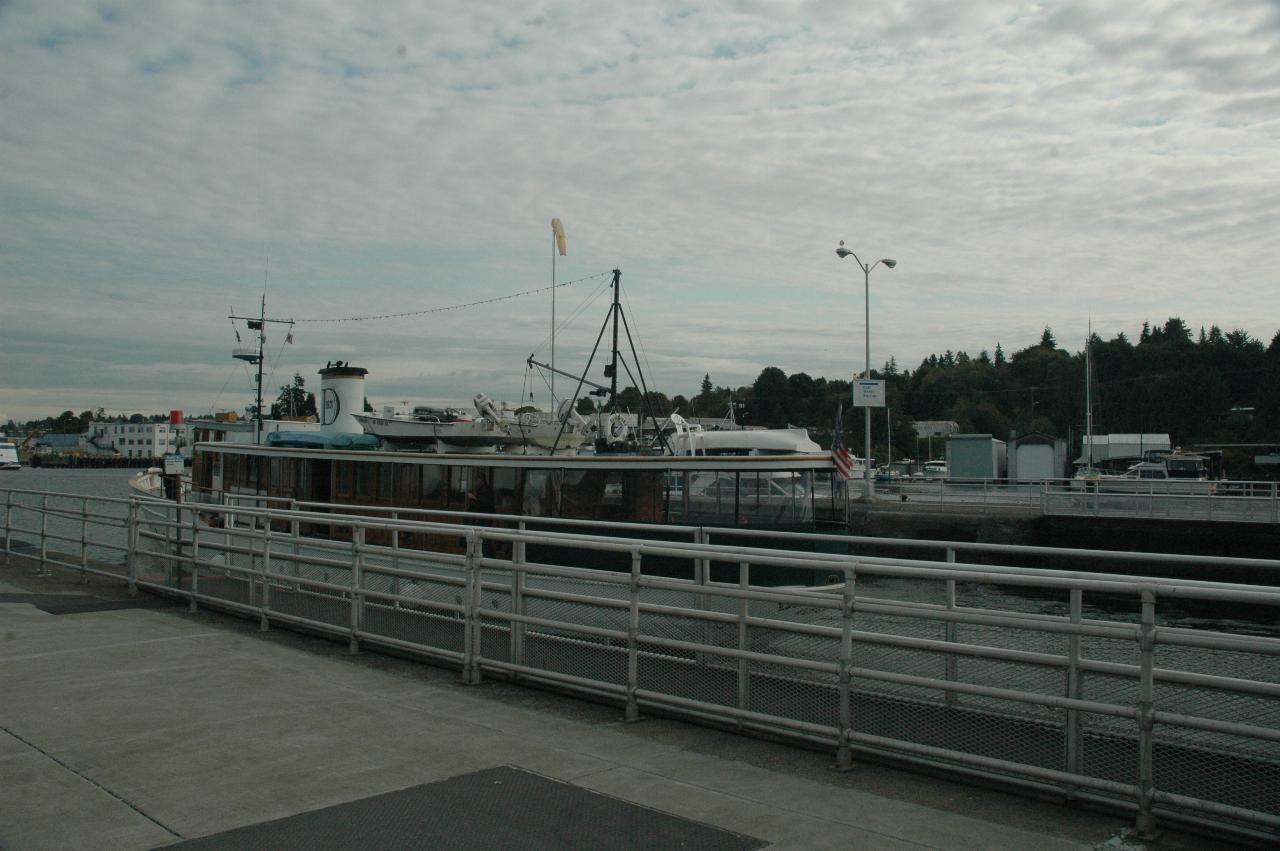 The wooden boat from earlier sailing out of Ballard Locks towards Lake Union